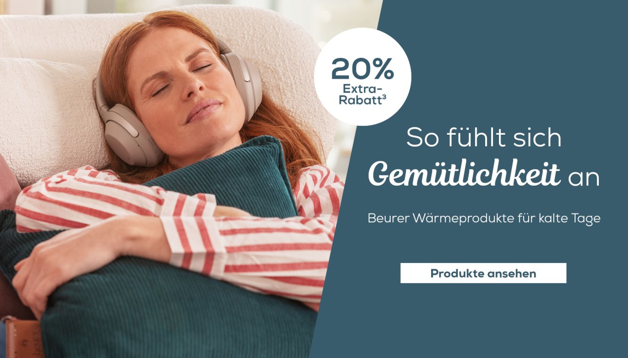 Frau liegt auf Sofa mit Heizdecke; Text im Bild: „Wohlige Wärme für kalte Tage“
