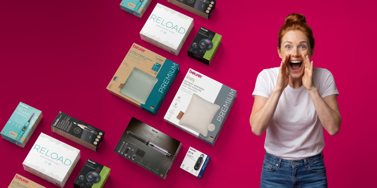beurer brand days A woman is standing in front of a pink background next to several packaged Beurer products.