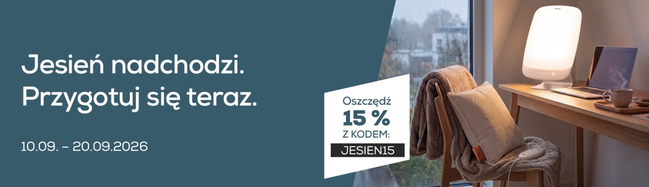 Na biurku widać różne produkty firmy Beurer, takie jak HK 77 i TL 95.