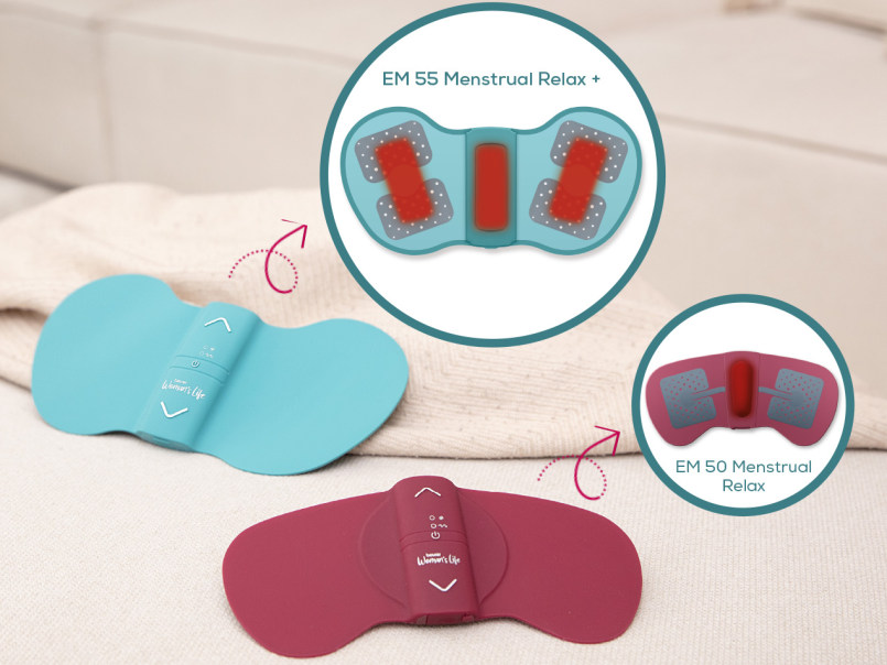 Das Beurer EM 50 liegt auf einer Decke und ein kleiner Kreis zeigt das Gerät von Hinten mit den Elektroden, die Wärme spenden