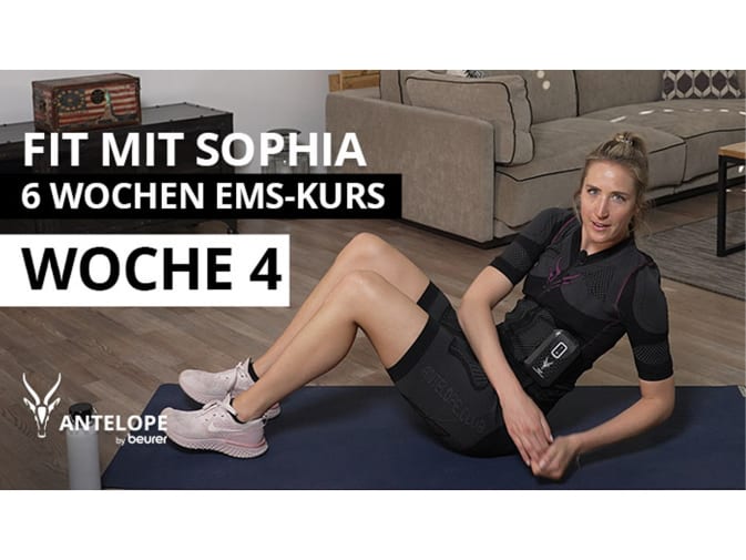 Sophia Bergner does a fitness exercise on the floor in the mobile EMS suit from Antelope. She can be seen on the right of the picture wearing her blonde hair in a ponytail. ‘Fit with Sophia - 6 week EMS course - week 4’ is written on the left.