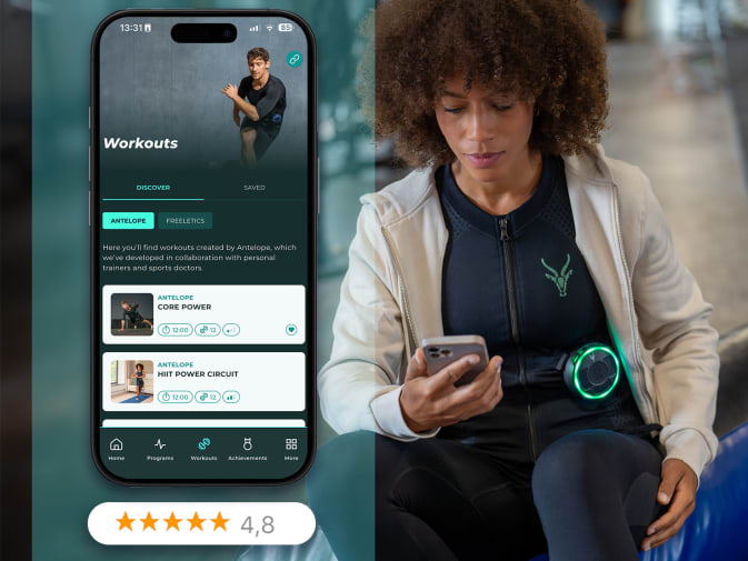 A woman selects an EMS workout from the Antelope Training app.