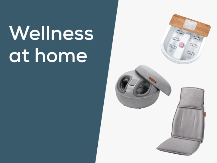 Homepage Teaser "Wellness at home" mit Produktbildern von drei Beurer Produkten: Fußsprudelbad, Fußmassagegerät und Massagesitzauflage