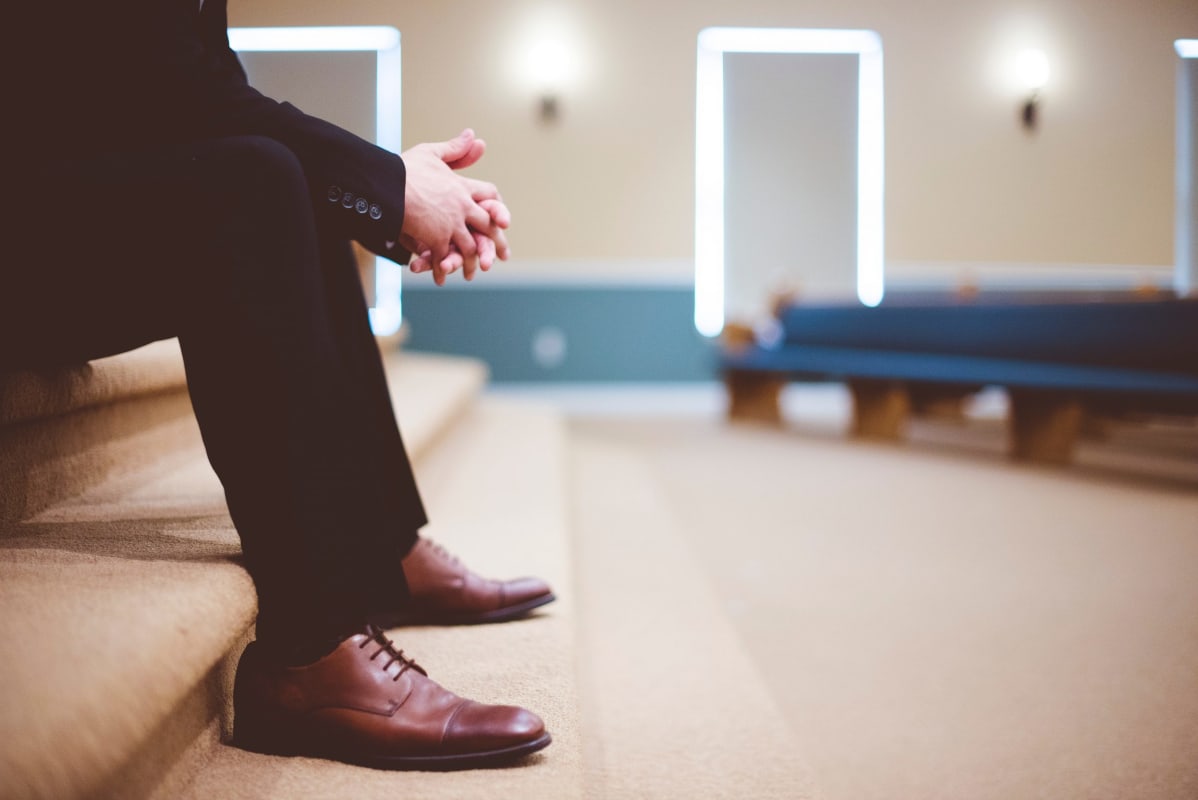 Man looking nervous in church