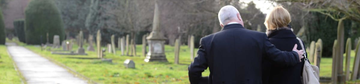 An Albany Funerals team member comforts a funeral guest.