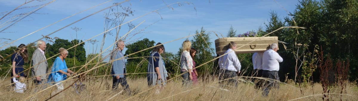 A funeral procession on foot, with Albany Funerals