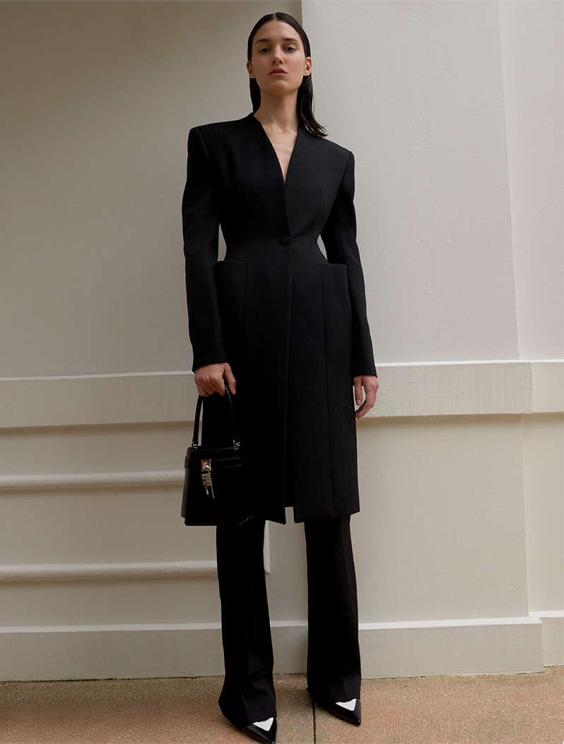 Model wears Givenchy - Hourglass Wool Top Coat & Straight-Leg Formal Wool Trousers