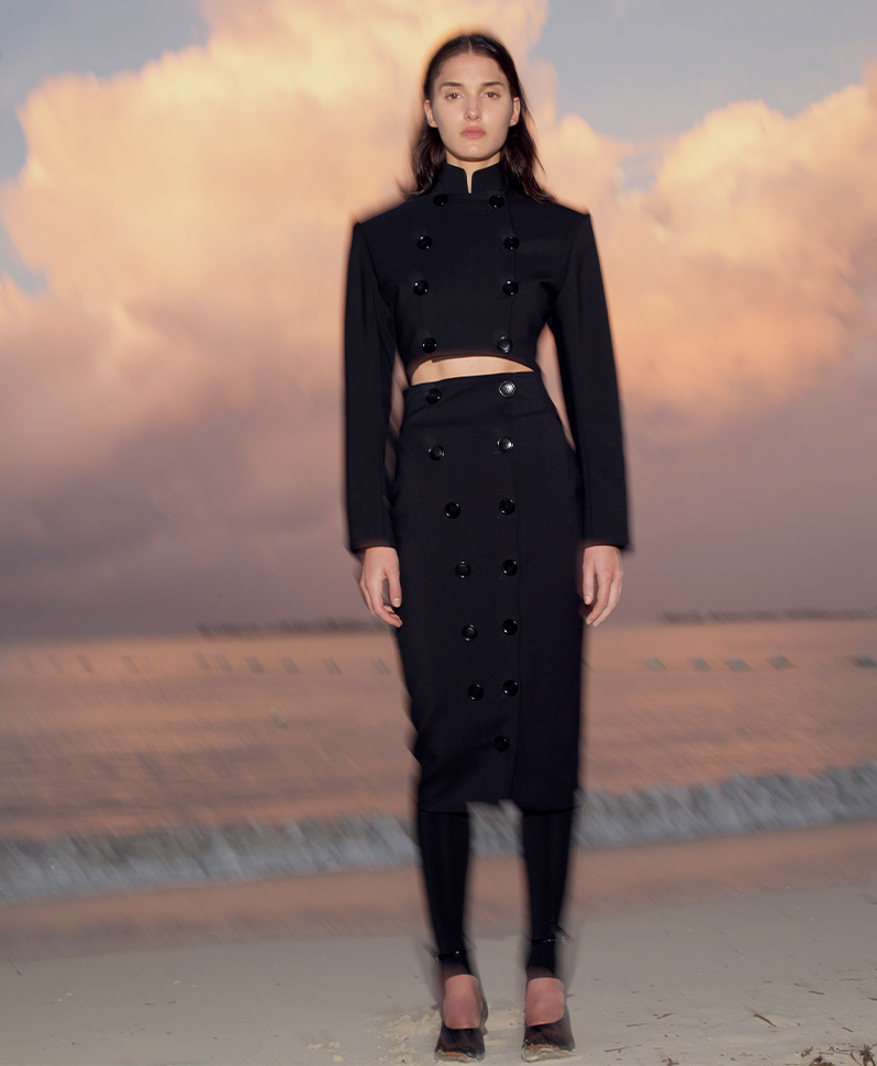 Model Wears Alaa - Cropped Wool Jacket with Button Detail and Hourglass Wool Pencil Skirt with Button Detail