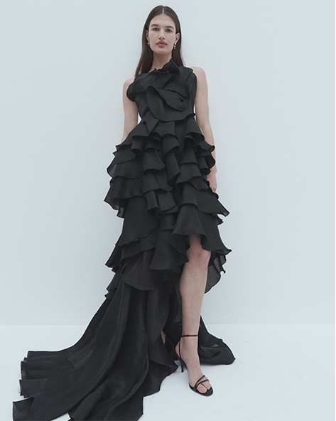 Model wears Marchesa - Strapless Tiered Ruffle Petal Gown