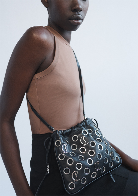 Model Wears Christian Louboutin - Mouchara Tote in Nappa Leather with Eyelets