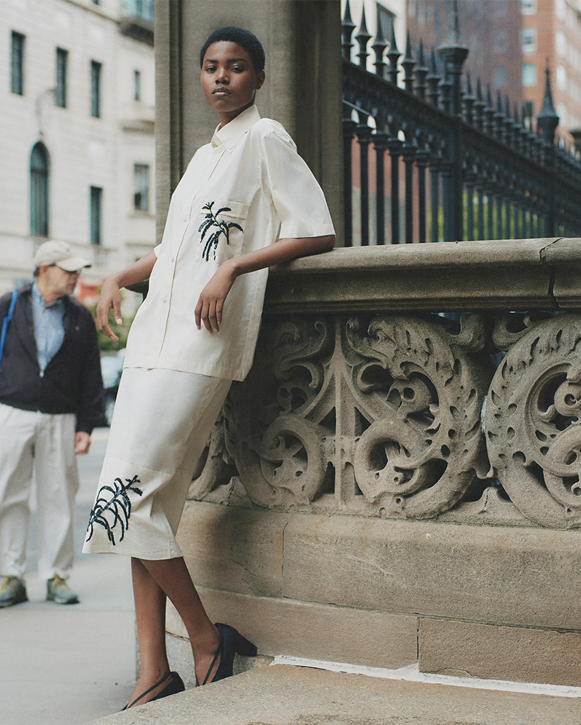Model wears PLAN C Sequined Button Down Cotton Shirt, Embroidered Midi Cotton Skirt, and Lambskin Elastic-Band Pumps