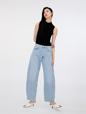 Model wears Agolde jeans