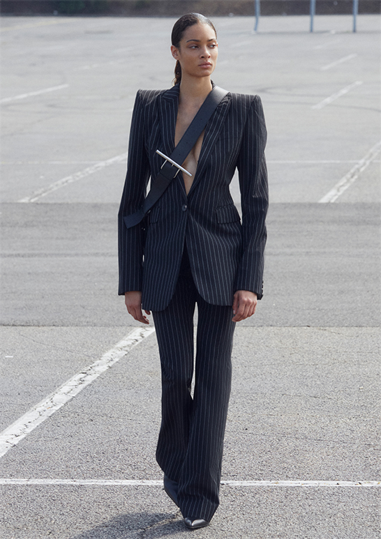 Model Wears Alexander McQueen - Pinstripe Single-Breasted Blazer and High-Rise Pinstripe Flared Trousers