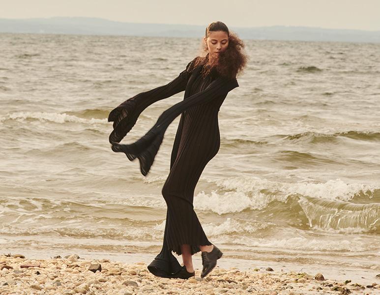 Model wears Issey Miyake - Asagao Stripe Knit Shrug