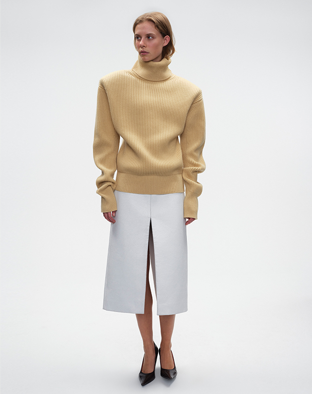 Model wears - Stella McCartney - Cashmere Ribbed Foldover Turtleneck and Faux Leather Midi Skirt with Front Slit