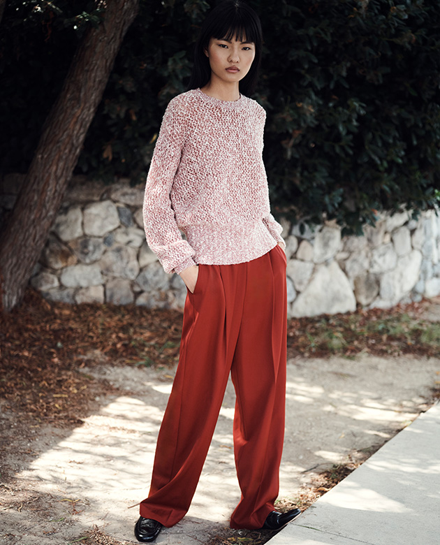 Model wears Agnona - Speckled Cashmere Wool Sweater and Light Wool Jane Straight Leg Pants in Cardinal