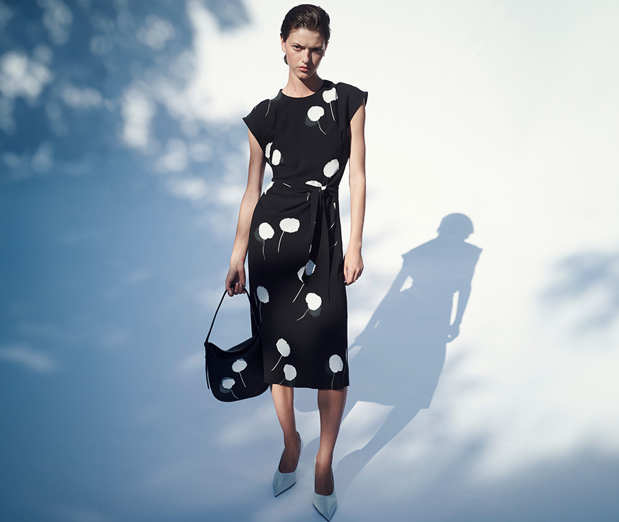 Model wears Akris - Windflower-Print Cap-Sleeve Crepe Midi Dress With Detachable Bow