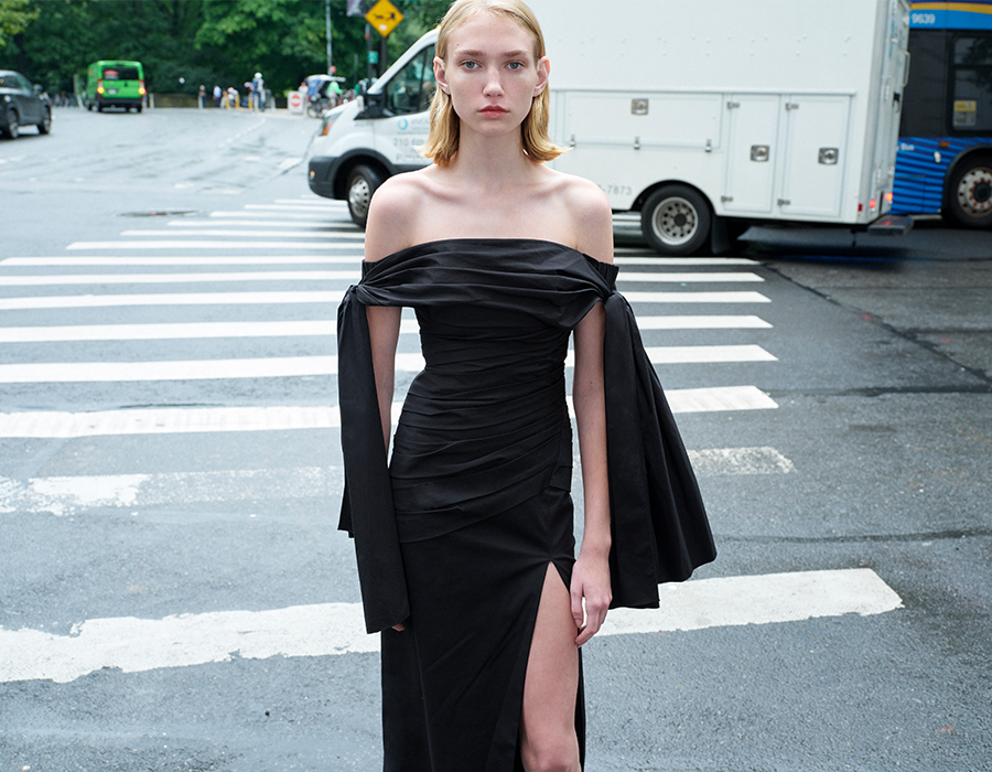 Model wears Carolina Herrera - Off-Shoulder Tie Draped Midi Dress