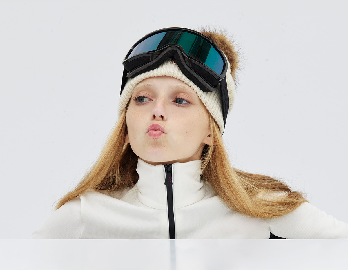 Model wears Moncler - Ribbed Logo Beanie with Faux Fur Pom