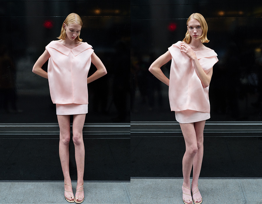 Model wear Khaite - Selly Collared V-Neck Silk Top and Jett Skirt in Soft Pink Suede