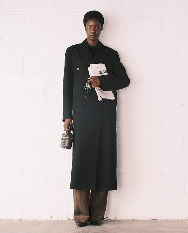 Model wears Loulou Studio - Temo Long Double-Breasted Coat