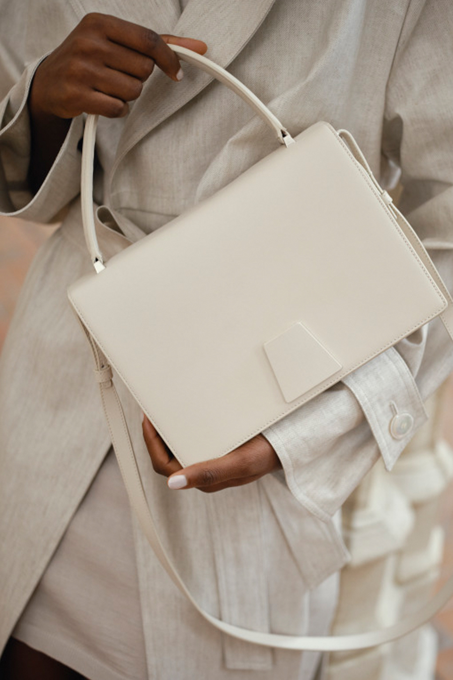 Model wears Akris - Alice Flap Leather Crossbody Bag