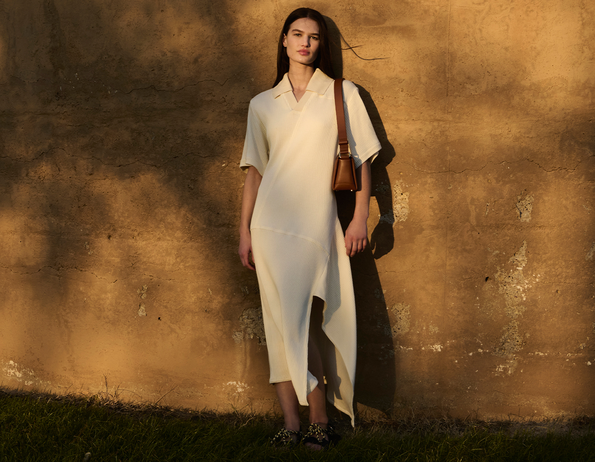 Model wears Plan C - Asymmetric Ribbed Polo Midi Dress