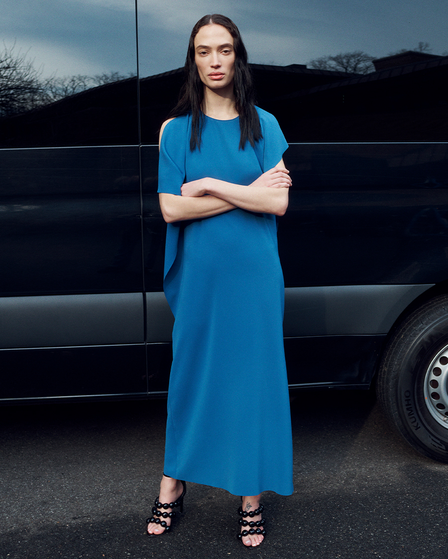 Model wears Akris Punto - Lasercut Off-Shoulder Drape Midi Dress