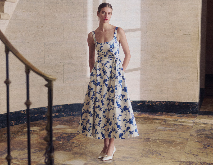 Model wears Carolina Herrera - Floral Scoop Neck Midi Dress with Sash