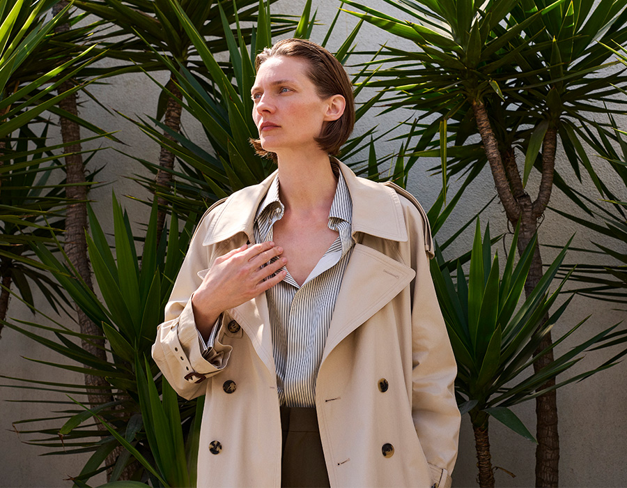 Model wears Saint Laurent trench coat