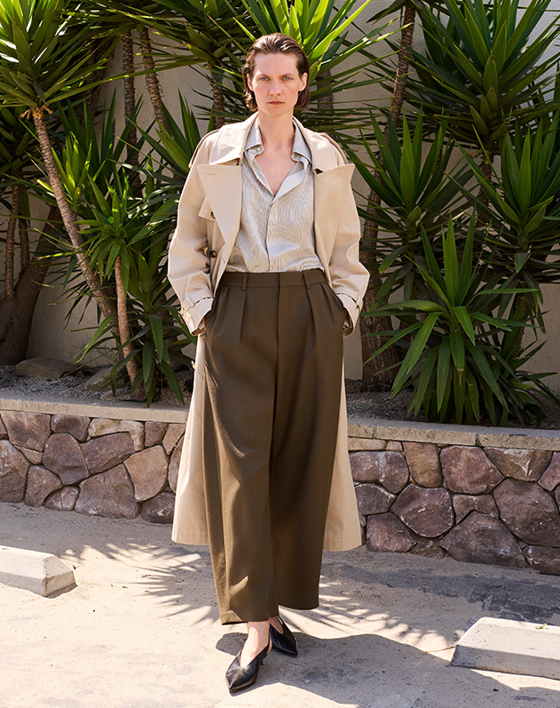 Model wears Saint Lairent trench coat
