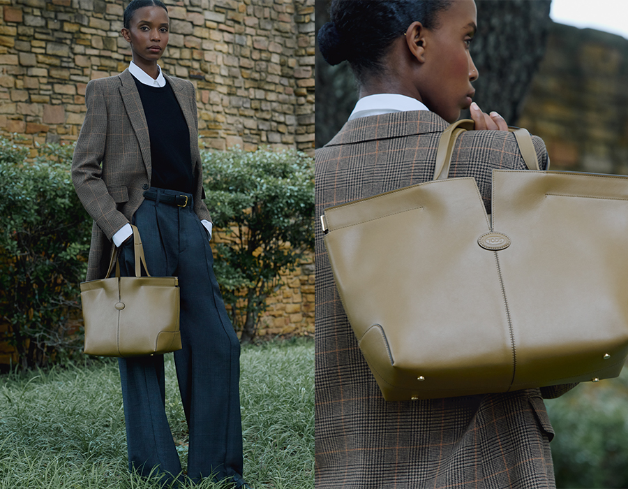 Model holds Tod's - Medium Leather Di Folio Tote Bag