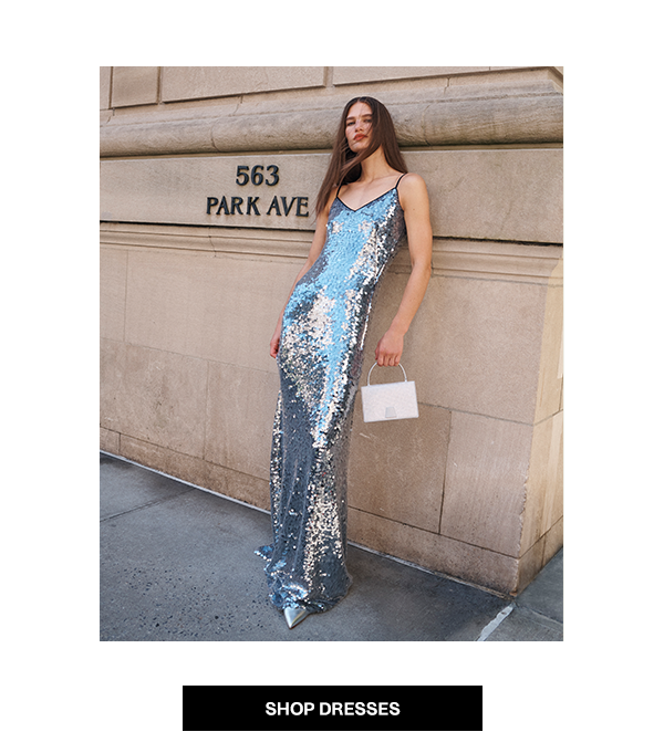 Model wears Akris - Shop Dresses