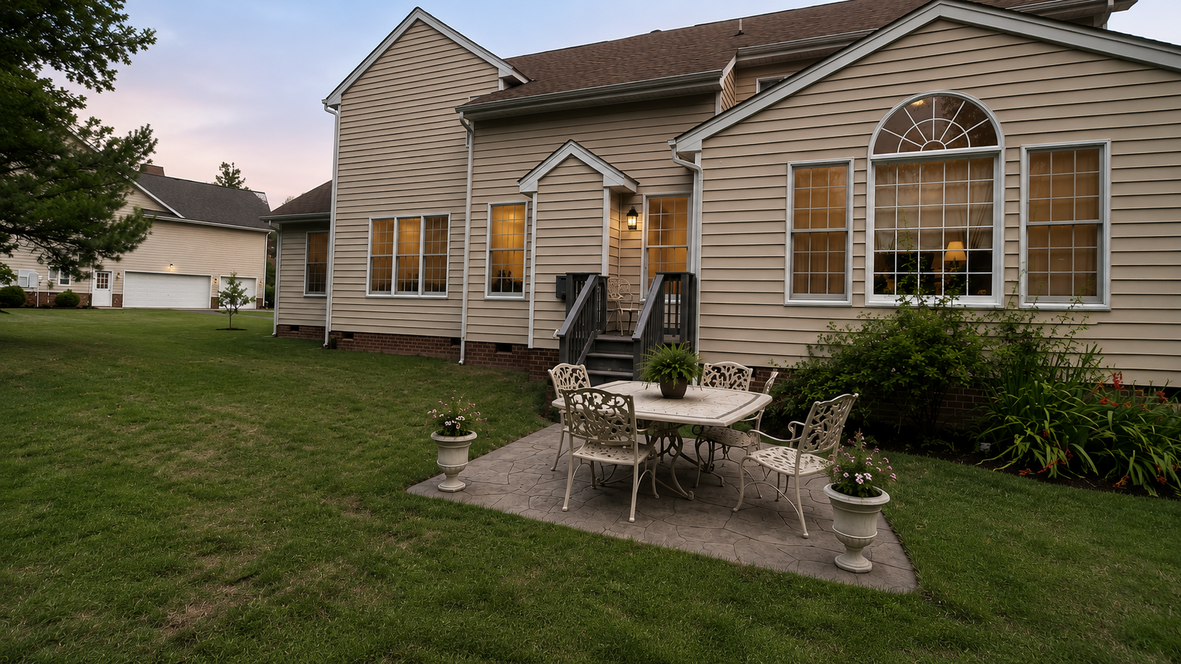 Rear exterior and patio of the private retreat estate at dusk