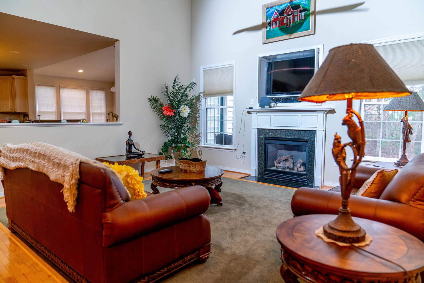 Sitting room with a fireplace and warm lamplight at the retreat estate