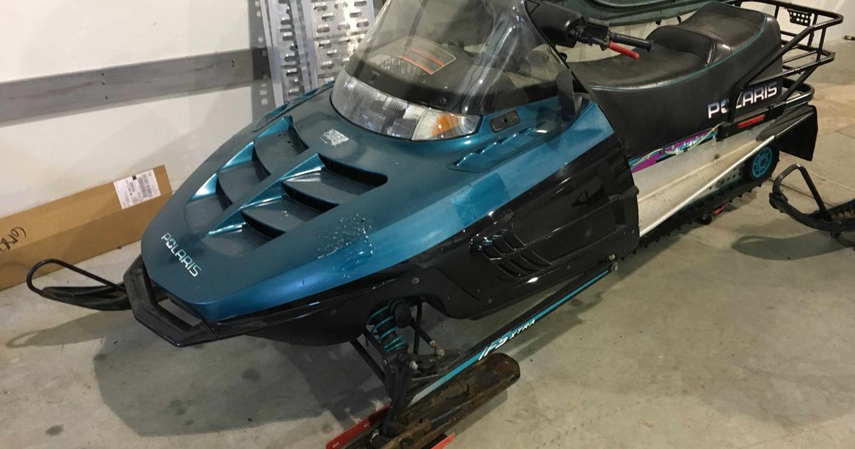 1997 Polaris Indy Trail Touring Snowmobile and Trailer, Offsite