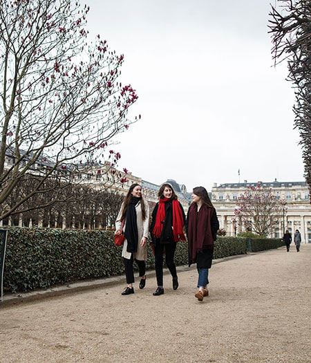 Three students walking through Paris