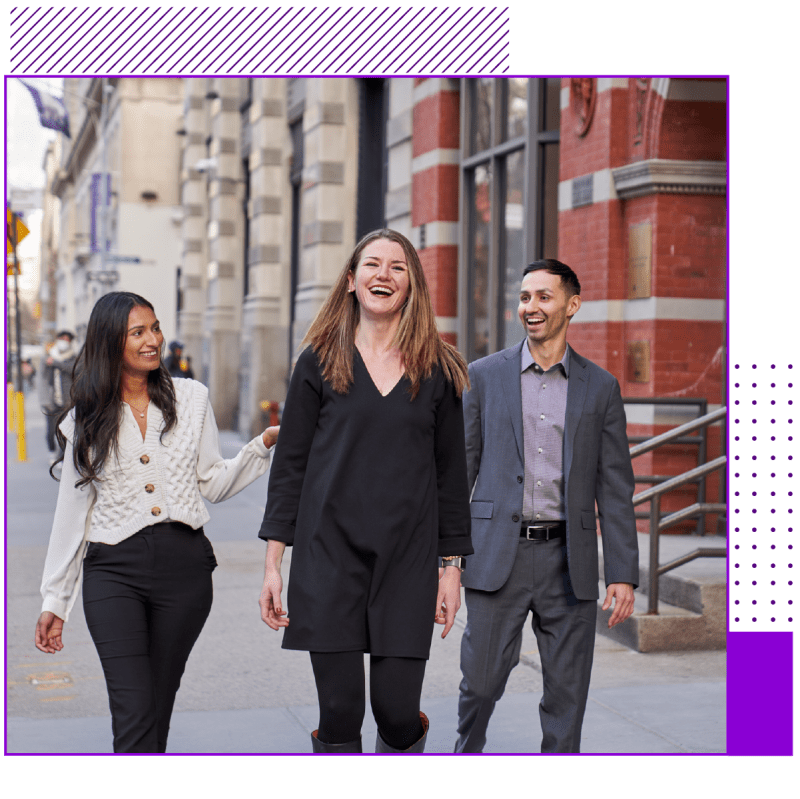 Three professional individuals walking on the street