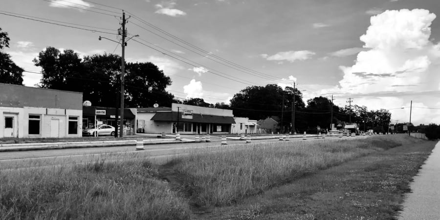 Cover photo showing the road under construction.