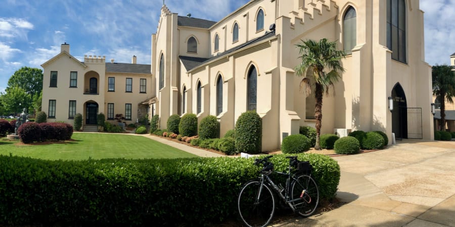 A photo of my bicycle in front of a church.