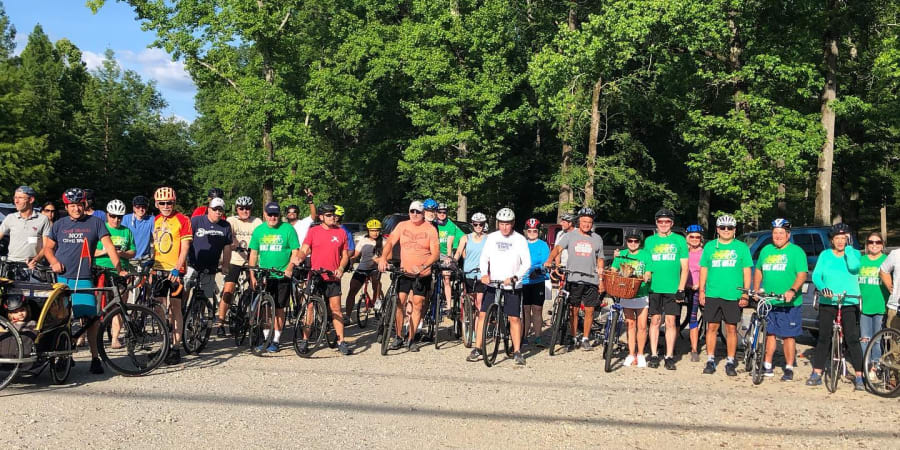 A group photo of bicycle riders.