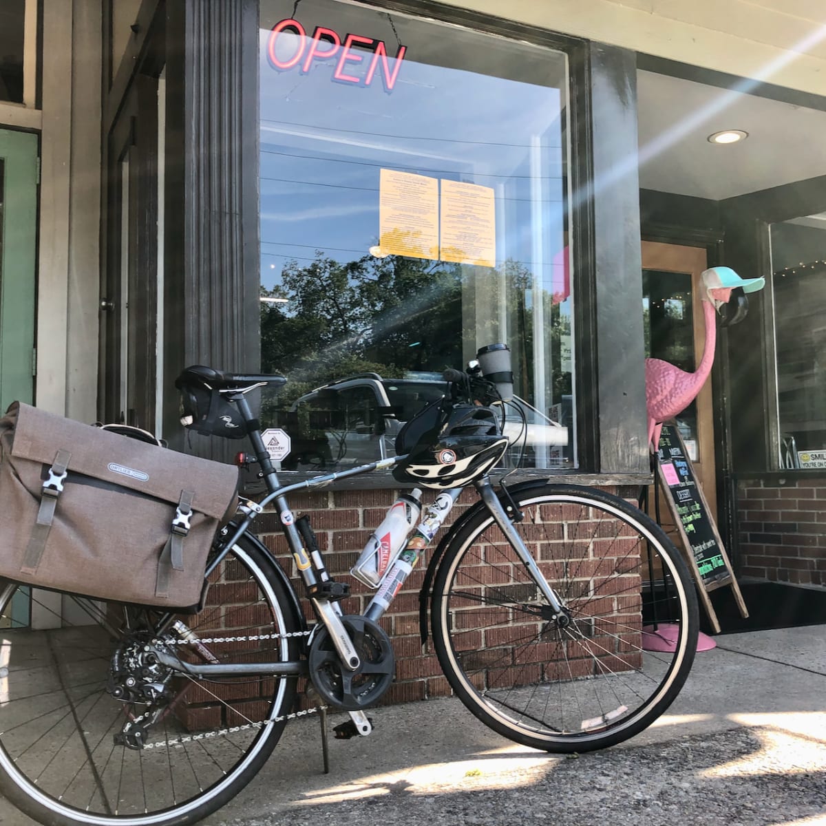 My bicycle in front of a storefront.