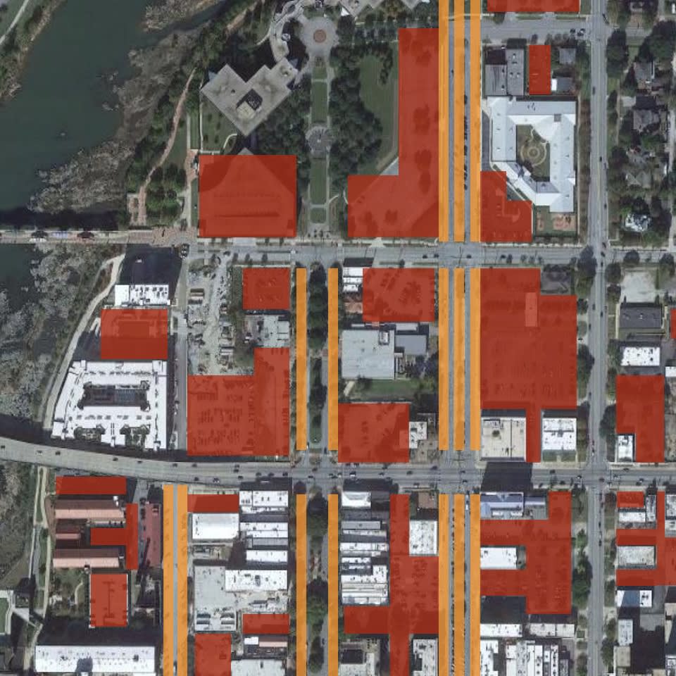 A satellite map of the Columbus, GA downtown with parking spots highlighted.