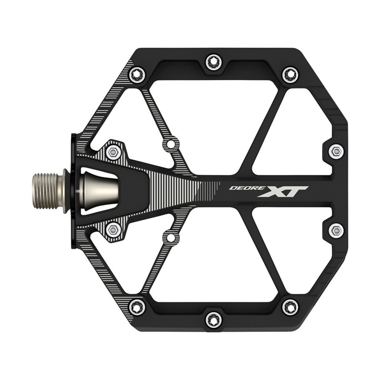 Our lightweight DEORE XT Enduro/Trail M8100 flat pedals are durably constructed to boost confidence in environments where grip means everything. Their wide, concave platform and adjustable pins keep pedals secure and stable underfoot. Experience even better bike control by pairing with SHIMANO GR series shoes.