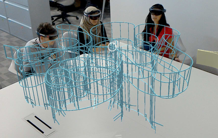 Aecom employees review the fabrication model of the Barkow Leibinger Summer House Aecom employees review the fabrication model of the Barkow Leibinger Summer House