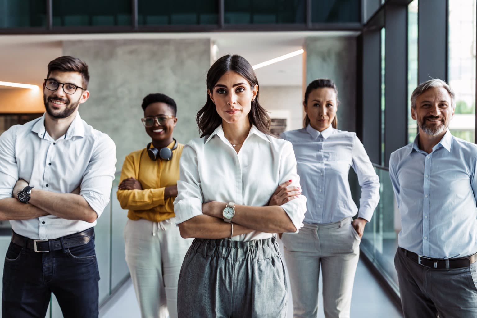 Group of diverse business casual people looking at the camera.