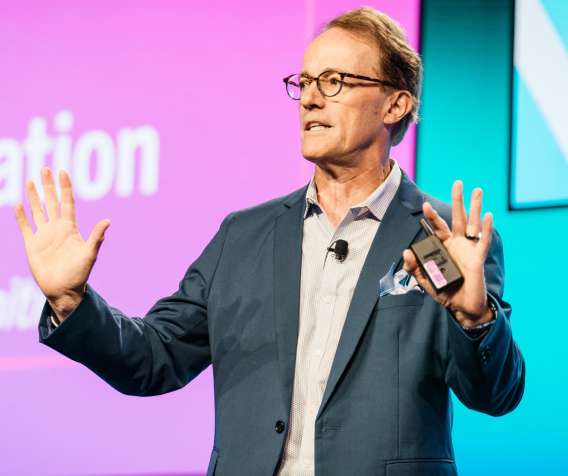 Keynote speaker, Andrew Busch, presents on stage at Lending Tech Live