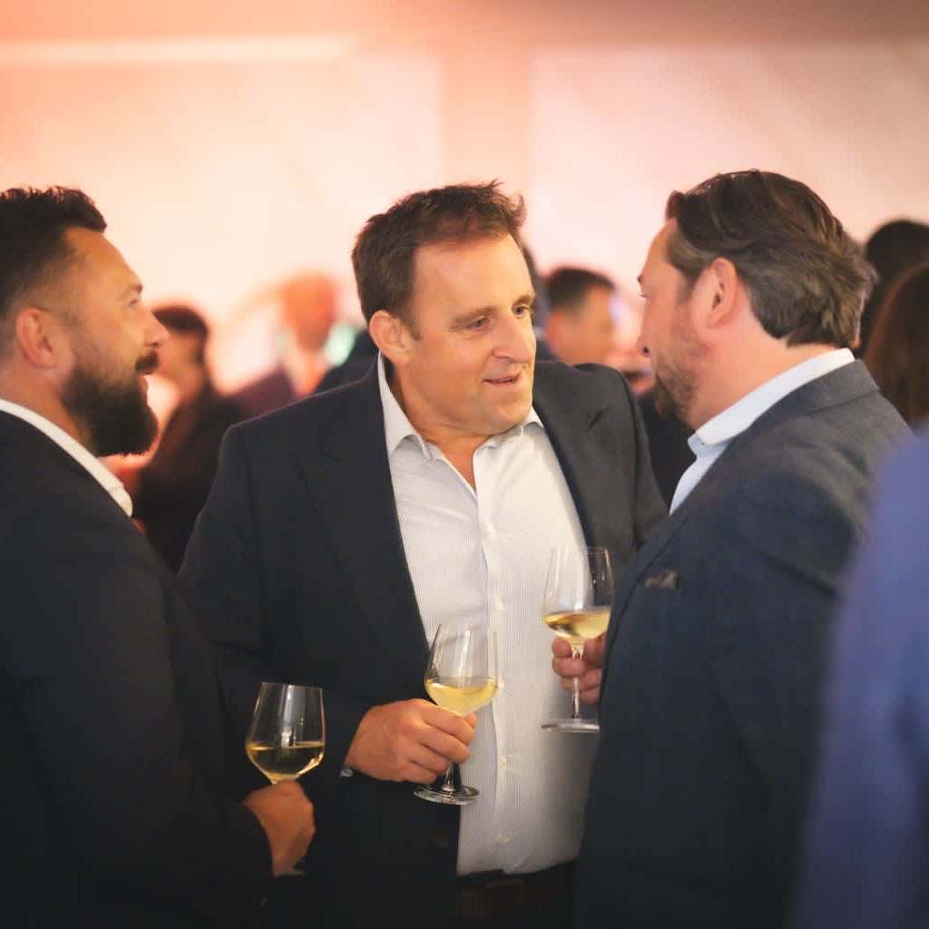 Delegates networking and having a conversation at the With Intelligence by S&P Global Drinks reception