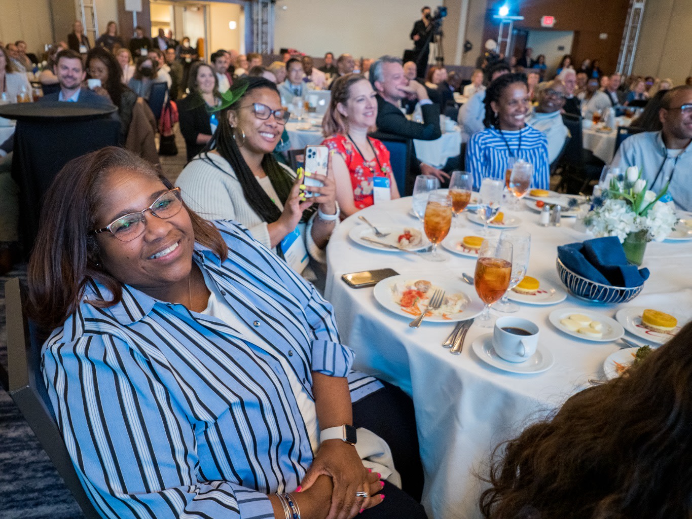 A smiling audience during the partnering in support of students panel