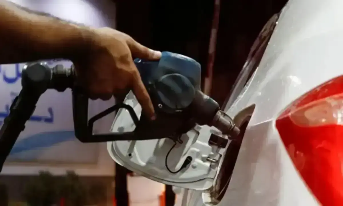 A fuel-pump nozzle filling a car at a petrol station; representational file photograph